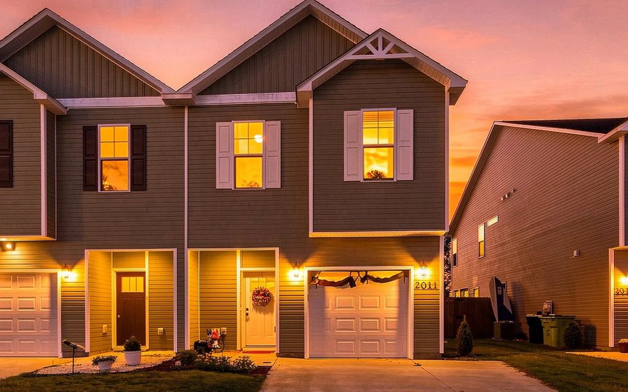 2011 Folkstone Woods Lane townhome at sunset, windows lit
