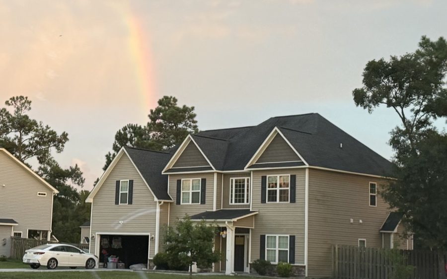 534 Saratoga Road, a two-story home in Sneads Ferry under a rainbow